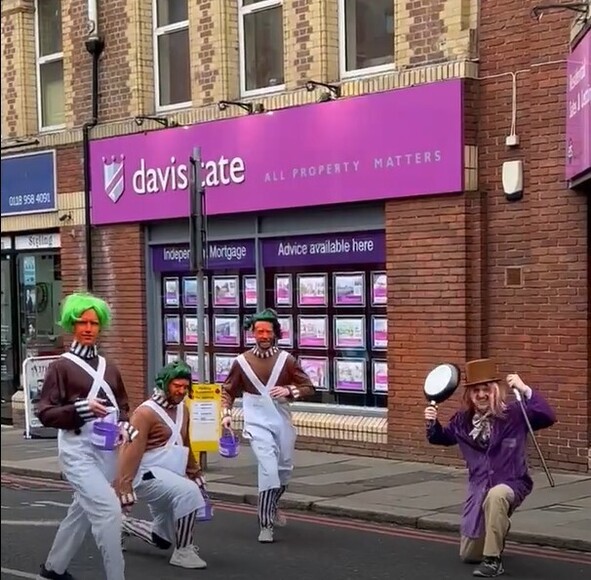 Estate agents dressed up as Willy Wonka and the Oompa Loompas