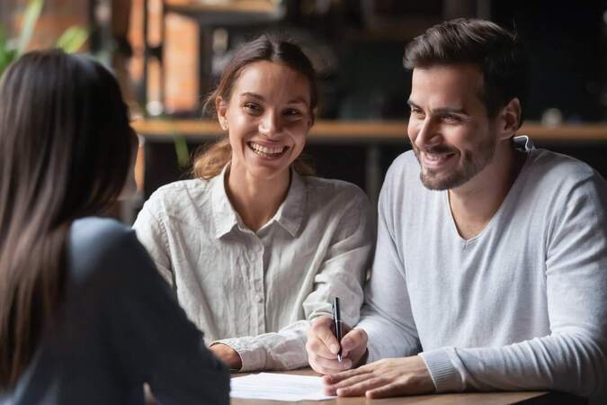 Happy couple selling house